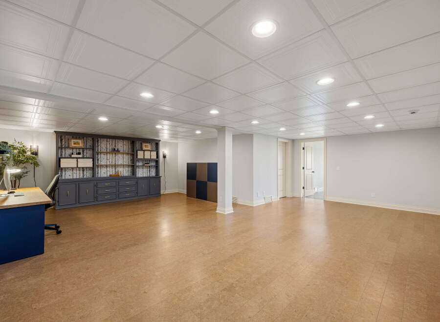 Discover the potential of this spacious, well-lit room, perfect for a home office, entertainment area, or additional living space.