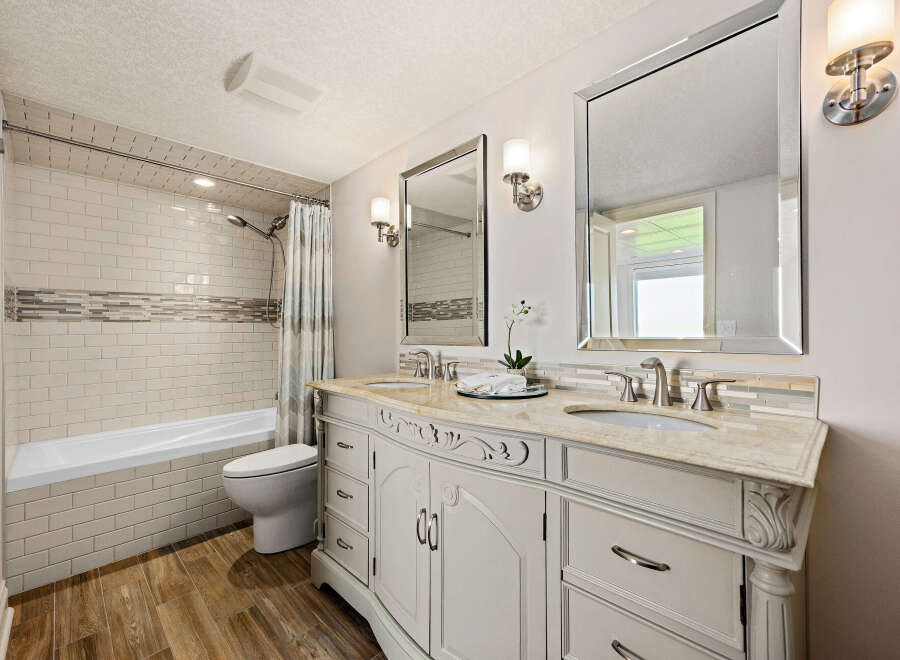 Step into luxury with this beautifully designed bathroom! Featuring a stunning vanity with ample storage, elegant mirrors, and stylish lighting, this space is perfect for relaxation and rejuvenation.