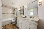 Step into luxury with this beautifully designed bathroom! Featuring a stunning vanity with ample storage, elegant mirrors, and stylish lighting, this space is perfect for relaxation and rejuvenation.