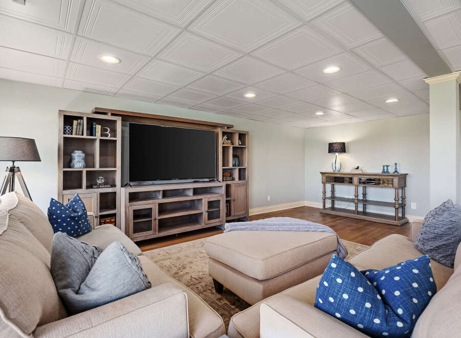 This stunning living room boasts a stylish entertainment center, perfect for movie nights and gatherings.