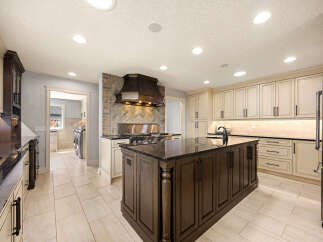 Step into a stunning kitchen with a large island, perfect for culinary creations and entertaining.