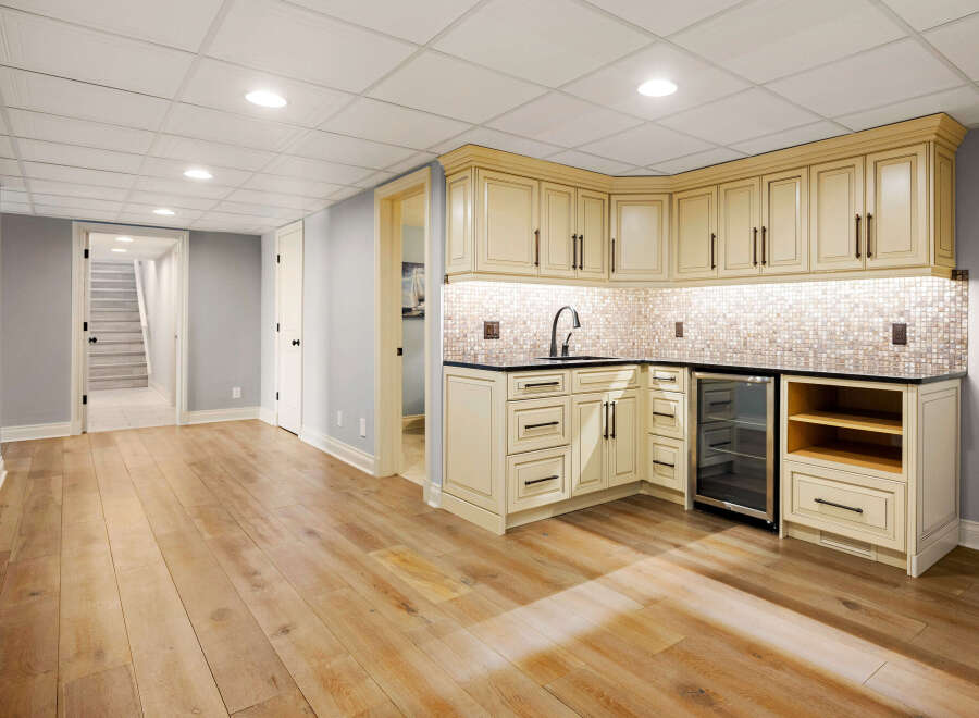 This stunning property boasts a beautifully designed wet bar, perfect for entertaining guests or enjoying a relaxing evening.