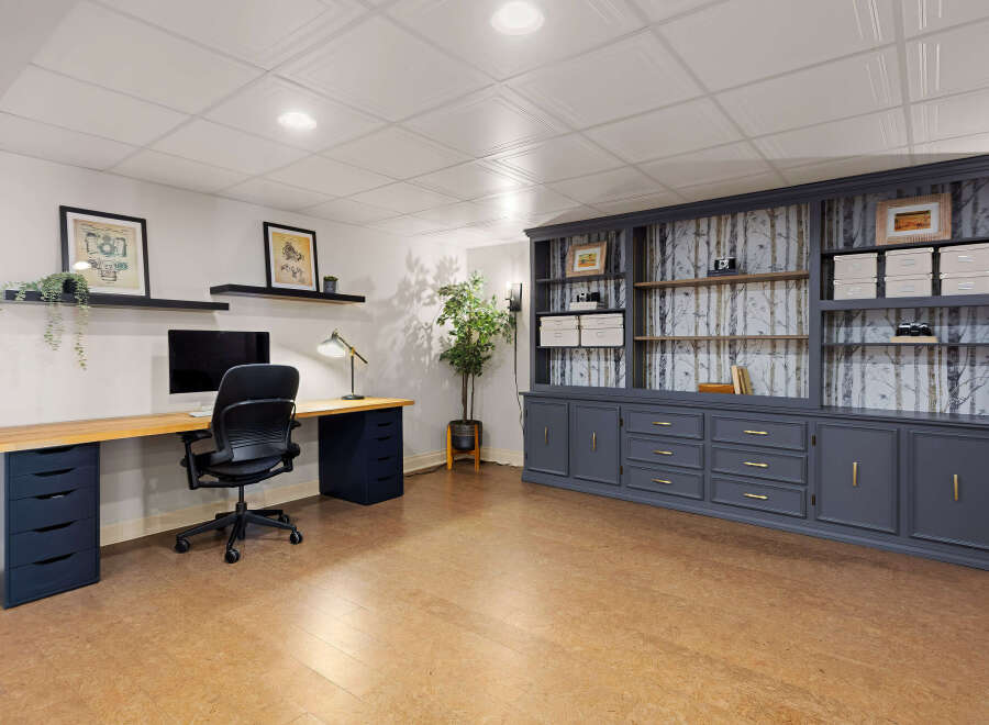 This stunning home office boasts a modern design with ample storage and workspace.