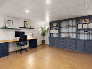 This stunning home office boasts a modern design with ample storage and workspace.