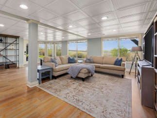 Step into this inviting living space, perfect for relaxation and entertaining.