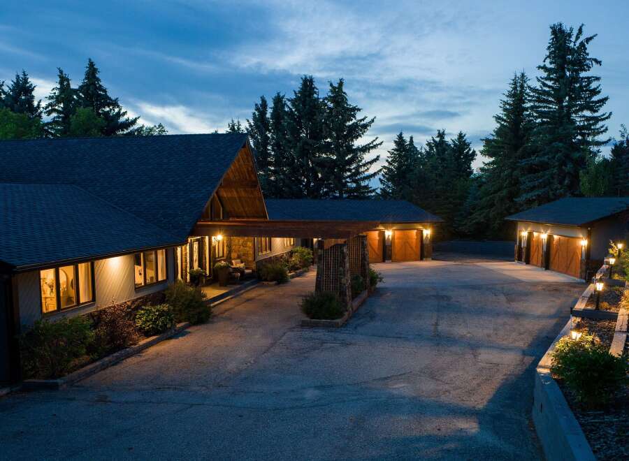 This stunning property features a beautifully designed home with a unique architectural style, perfect for those seeking a luxurious living experience.