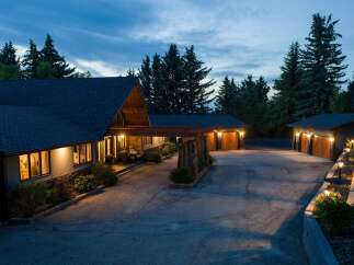 This stunning property features a beautifully designed home with a unique architectural style, perfect for those seeking a luxurious living experience.