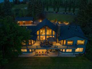 This stunning property boasts a luxurious design with a spacious deck, perfect for outdoor entertaining.