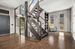 Step into luxury with this stunning home featuring a modern staircase with glass railings, creating an open and airy feel.