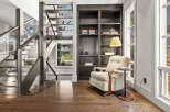 This stunning property boasts a modern interior with a beautiful staircase and hardwood floors.