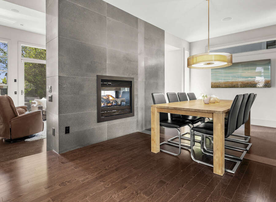 This stunning property boasts a modern interior with a cozy fireplace, perfect for those chilly evenings.