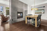 This stunning property boasts a modern interior with a cozy fireplace, perfect for those chilly evenings.