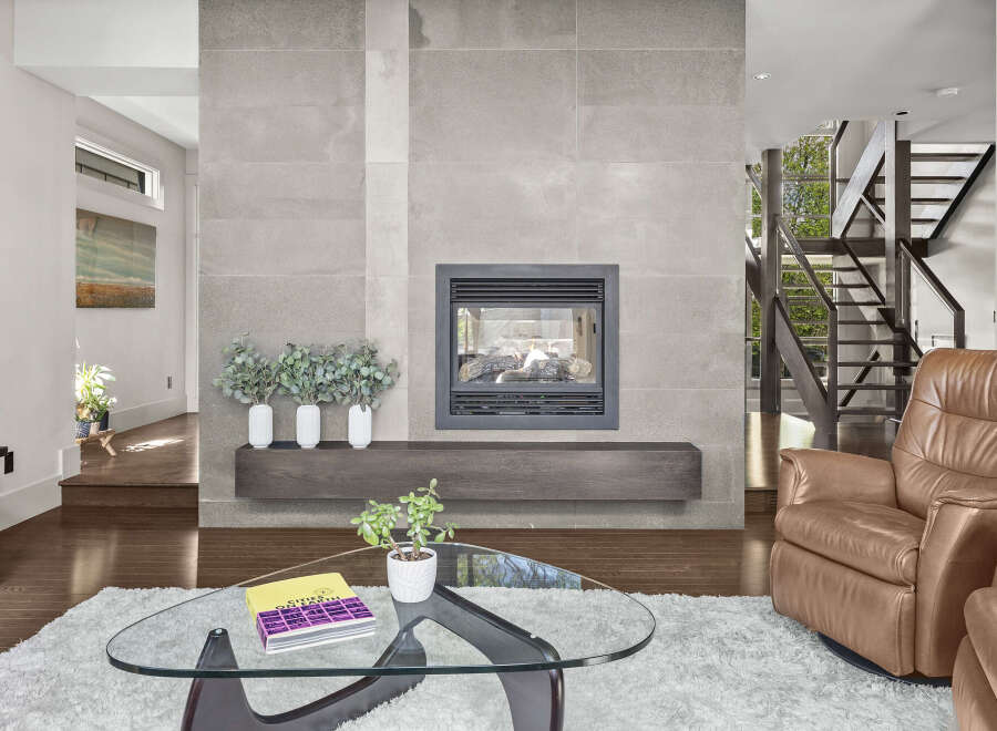 This stunning living room boasts a modern fireplace, perfect for cozy evenings.