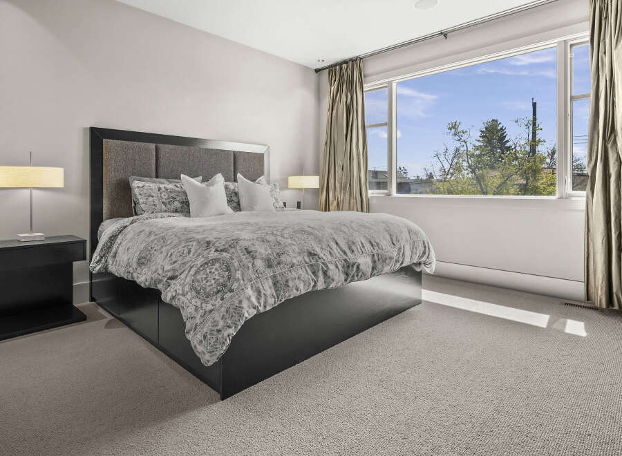 Step into a serene bedroom retreat, where modern design meets comfort.
