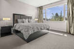 Step into a serene bedroom retreat, where modern design meets comfort.
