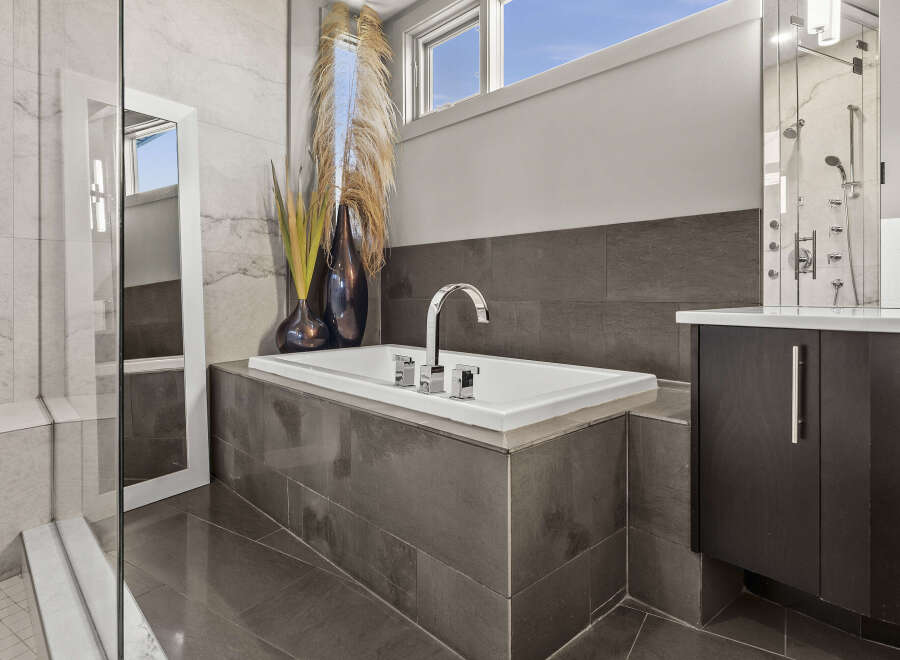 Indulge in luxury within this stunning bathroom, featuring a sleek, modern design.