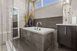 Indulge in luxury within this stunning bathroom, featuring a sleek, modern design.