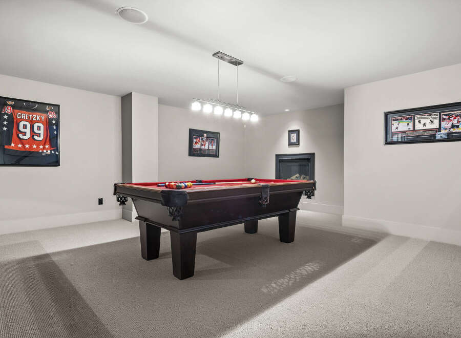 This stunning property boasts a dedicated game room, perfect for entertaining and relaxation.