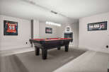 This stunning property boasts a dedicated game room, perfect for entertaining and relaxation.