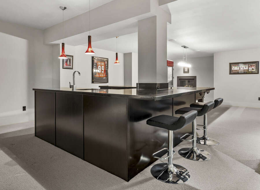 This stunning property boasts a stylish bar area, perfect for entertaining guests.