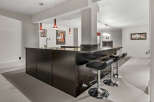 This stunning property boasts a stylish bar area, perfect for entertaining guests.