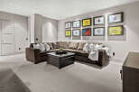 This inviting living space features a comfortable sectional sofa, perfect for relaxing and entertaining.