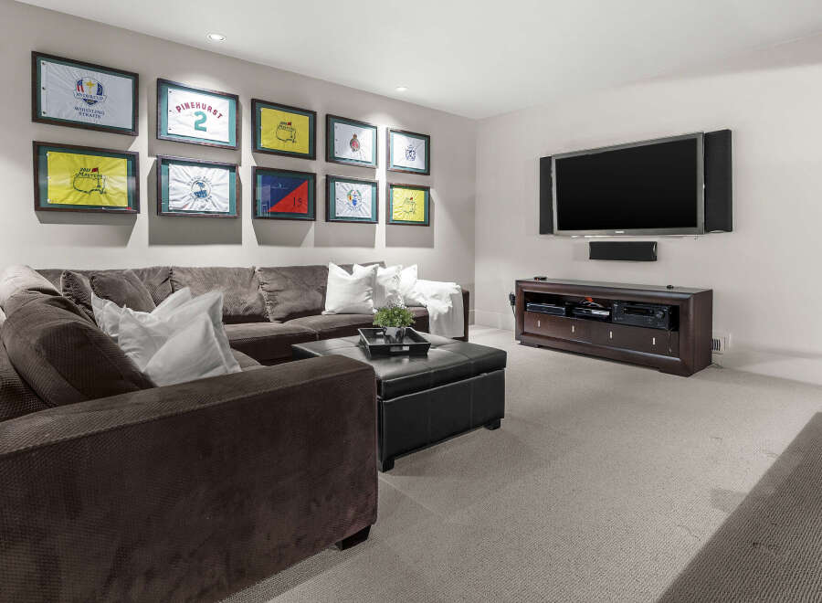 This stunning living room boasts a modern design with a comfortable sectional sofa, perfect for relaxing and entertaining.
