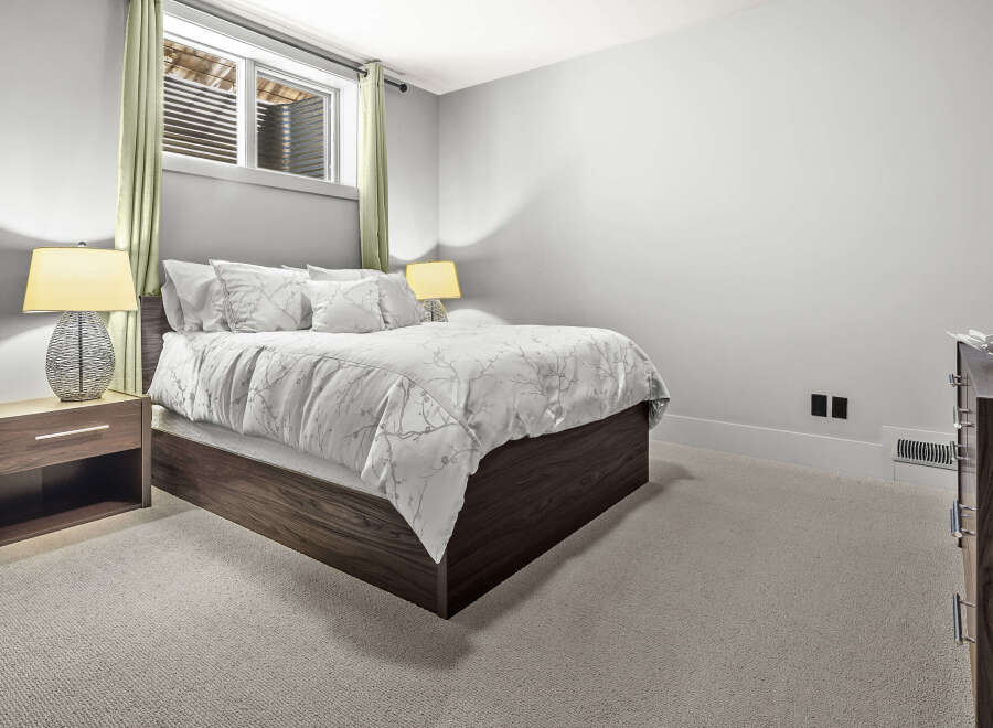 Step into a serene bedroom retreat, designed for comfort and style.