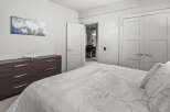 This modern bedroom offers a serene retreat with its neutral color palette and elegant design.