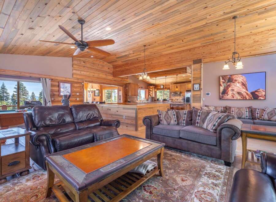 Step into luxury with this stunning property featuring a spacious living area with a cozy fireplace and a gourmet kitchen.