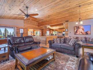 Step into luxury with this stunning property featuring a spacious living area with a cozy fireplace and a gourmet kitchen.