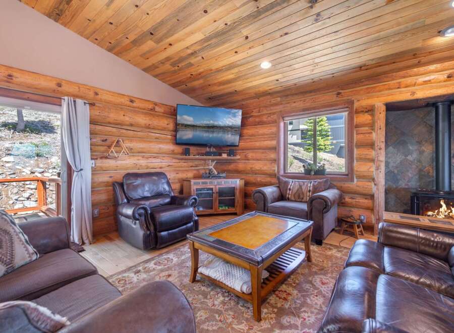 Step into rustic elegance with this stunning cabin-style living room.