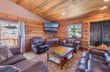 Step into rustic elegance with this stunning cabin-style living room.