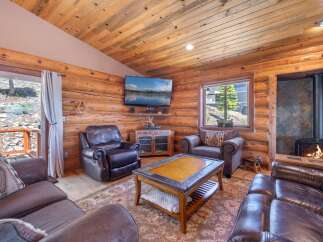 Step into rustic elegance with this stunning cabin-style living room.