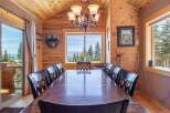 Step into a dining room that seamlessly blends rustic charm with breathtaking views.