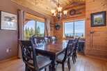 Step into this stunning dining room, featuring a beautiful wooden table and chairs, perfect for hosting memorable gatherings.