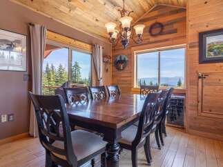 Step into this stunning dining room, featuring a beautiful wooden table and chairs, perfect for hosting memorable gatherings.