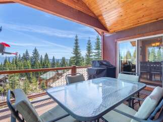 Enjoy breathtaking mountain views from this stunning property! This home features a spacious deck with a glass-top table, perfect for outdoor dining and relaxation.