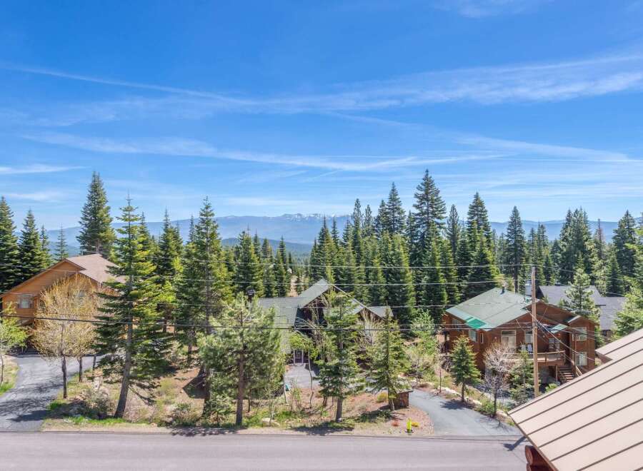 Nestled amidst towering trees and breathtaking mountain views, this property offers a serene escape.