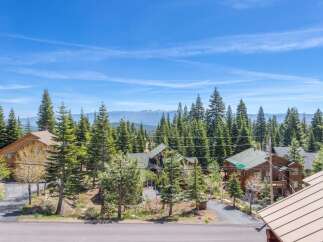 Nestled amidst towering trees and breathtaking mountain views, this property offers a serene escape.