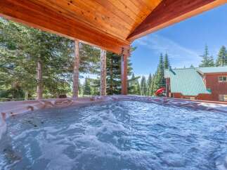 Relax and unwind in this luxurious hot tub, surrounded by the beauty of nature.