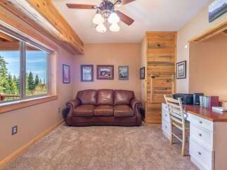 This cozy room features a comfortable leather sofa, perfect for relaxing.