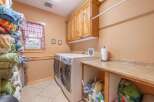 This laundry room offers a functional and stylish space for your laundry needs.