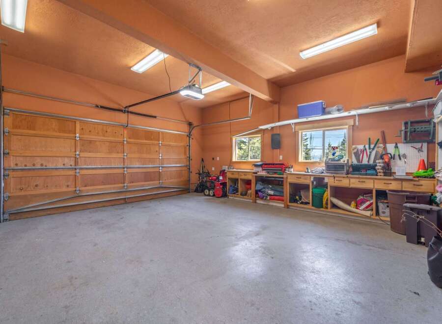 This spacious garage offers ample room for vehicles and storage, perfect for car enthusiasts or those needing extra space.