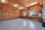 This spacious garage offers ample room for vehicles and storage, perfect for car enthusiasts or those needing extra space.