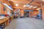 This spacious garage offers ample storage and workspace, perfect for any homeowner.