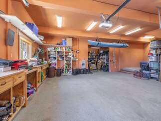 This spacious garage offers ample storage and workspace, perfect for any homeowner.