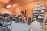 This garage offers ample storage space, perfect for organizing tools, equipment, and seasonal items.