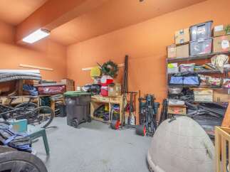 This garage offers ample storage space, perfect for organizing tools, equipment, and seasonal items.