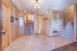 Step into this inviting entryway, showcasing a blend of rustic charm and modern design.